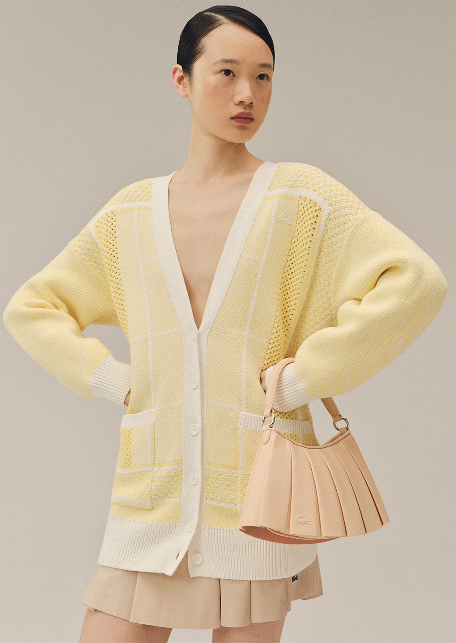 Women in Yellow Cardigan with Bag