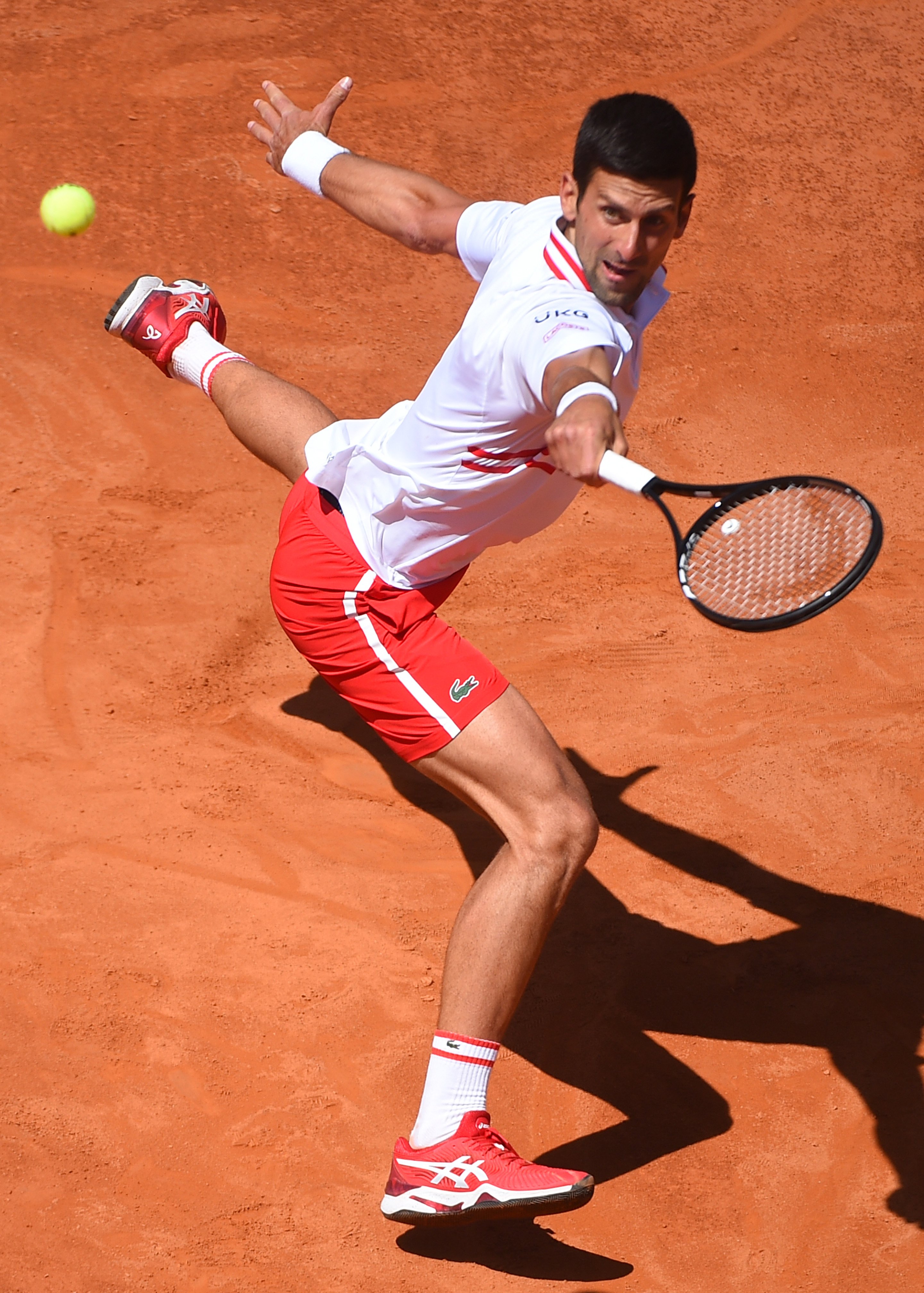 Novak in red Lacoste Backhand